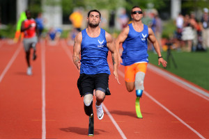 (L-R) Air Force Wounded Warriors, Nicholas Dadgostar and Gideon Conelly race in the 100 meter during Warrior Game Trials held at the United States Military Academy at West Point, New York. The competition consisted of more than 100 Army, Marine Corps and Air Force athletes competing in archery, cycling, shooting, sitting volleyball, swimming, track and field and wheelchair basketball tournaments during the 2014 Army Warrior Trials at West Point, June 15-19 for the chance to represent their service in the 2014 Warrior Games competition held in Colorado Springs, Colo.  (Department of Defense Photo by Marvin Lynchard)